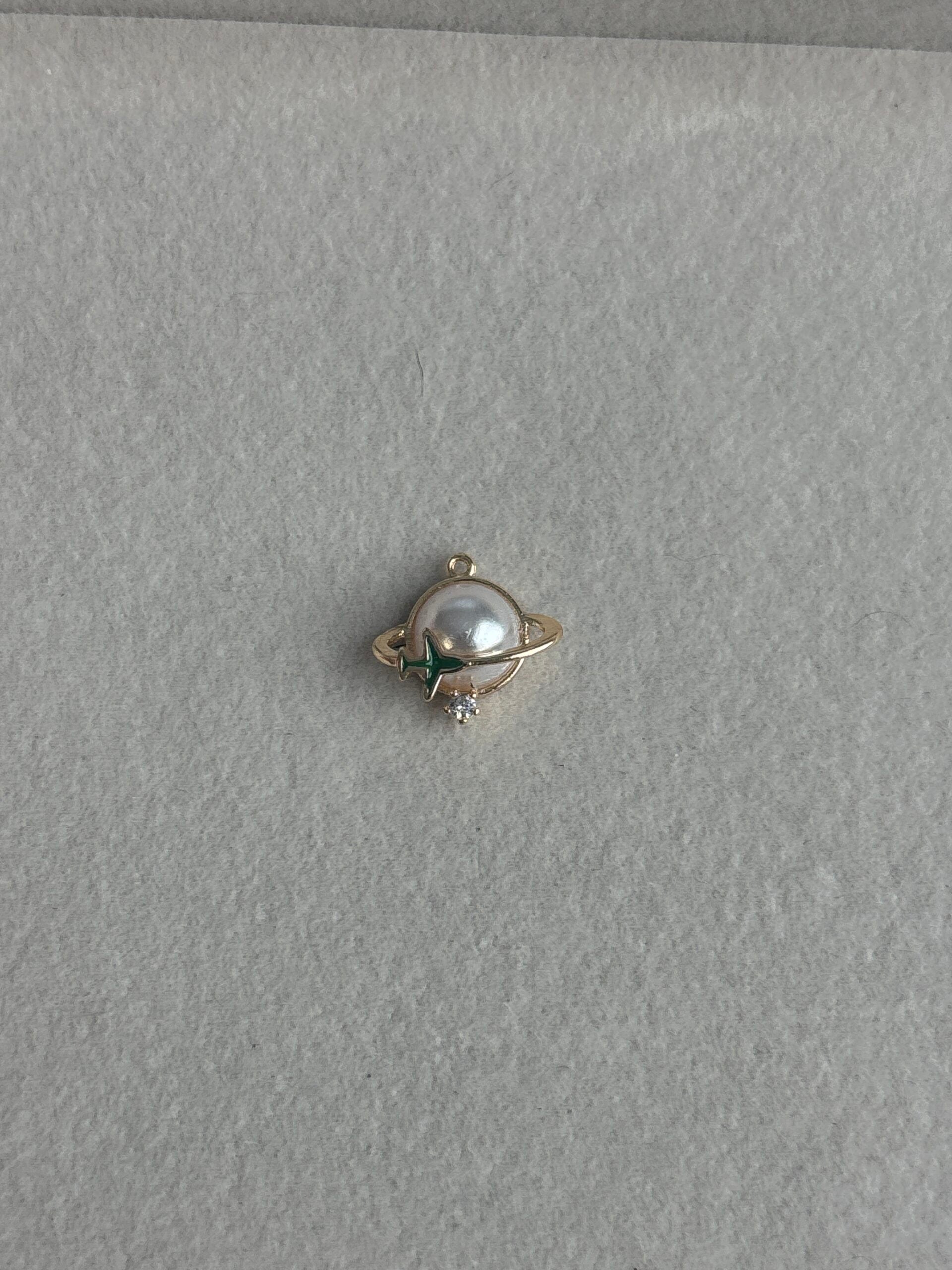 Pearl Planet Green Airplane Charm image 0